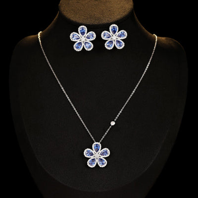Elegant jewelry set with a silver-tone necklace and matching stud earrings, featuring blue and clear floral gemstones. - Image 8