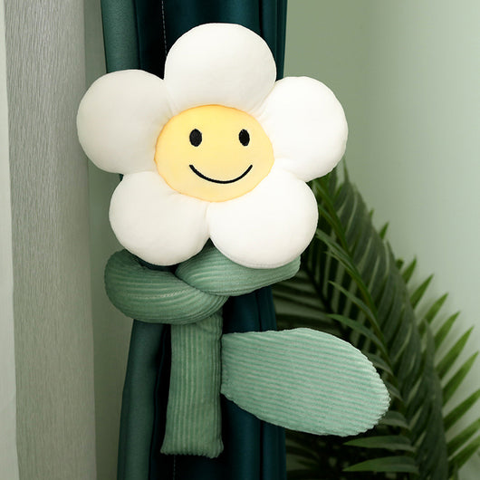 Plush white sunflower curtain buckle with a yellow smiley face center and green stem, holding back a dark green curtain. - Image 13