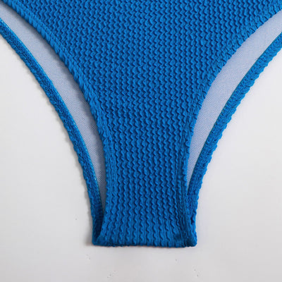 Blue high-waisted bikini set with a textured bandeau top and high-cut bottoms, laid flat on white. - Image 13