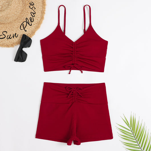 Women's two-piece swimsuit with tropical leaf and floral print. Features a ruched cropped camisole top and high-waisted swim shorts. - Image 5
