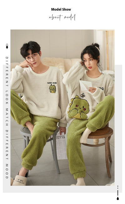 Couple wearing matching cream coral fleece pajamas with gray pants and bear embroidery, seated on a bed. - Image 17