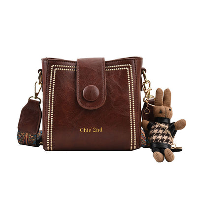 Bolsa Mensajera Retro con Textura Premium - Image 8