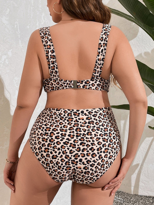 Leopard print two-piece bikini with a deep V-neck top and high-waisted bottoms, worn by a model. - Image 16