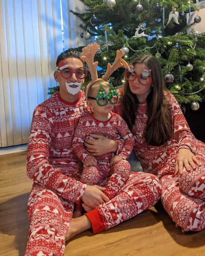 Red and white Christmas print one-piece pajama suit with moose, snowflake, and Christmas tree patterns. - Image 4