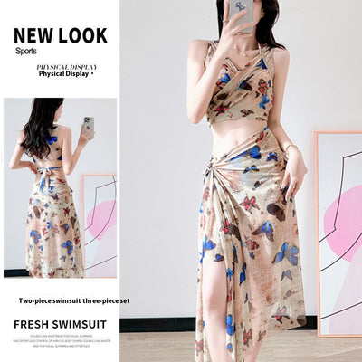 Women's light blue tropical leaf print three-piece swimsuit with short sleeve bikini top, bottoms, and sarong skirt. - Image 21