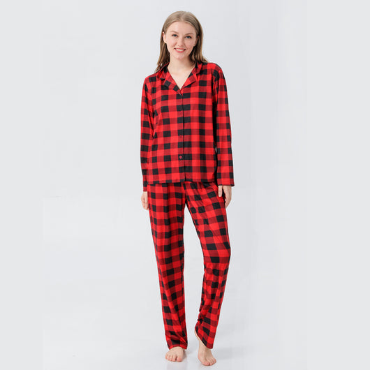 Baby in a red and black buffalo plaid long-sleeve pajama romper, viewed from the back with arms raised. - Image 20