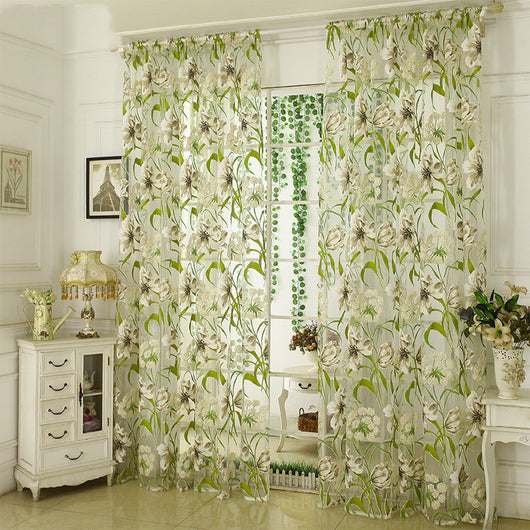 White sheer curtains with a green and beige floral pattern, hanging on a rod in a bright room. - Image 10