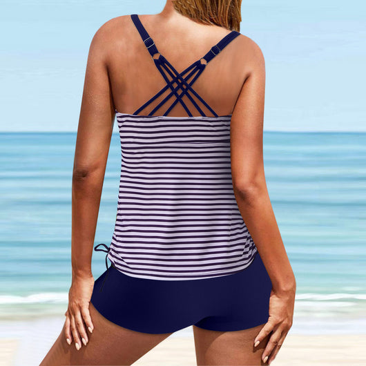 Fuchsia pink tankini swimsuit for women featuring a pleated halter top and matching swim shorts, modeled on a beach. - Image 17