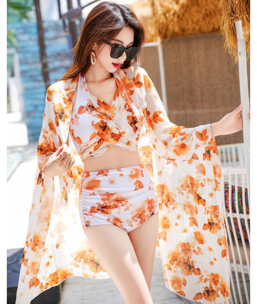 Women's light blue tropical leaf print three-piece swimsuit with short sleeve bikini top, bottoms, and sarong skirt. - Image 35