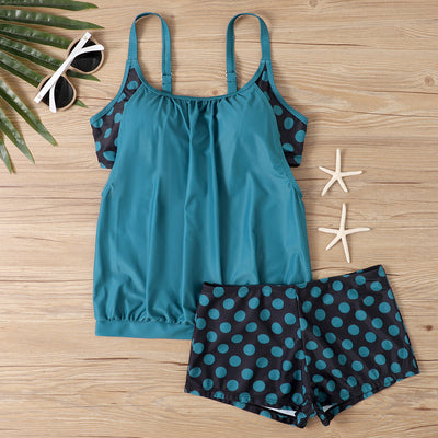 Women's two-piece swimsuit with a turquoise tankini top and black boxer bottoms with turquoise polka dots. - Image 9