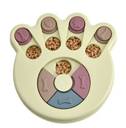 Paw-shaped dog puzzle feeder toy in light yellow with colorful sliding covers, filled with kibble. - Image 17