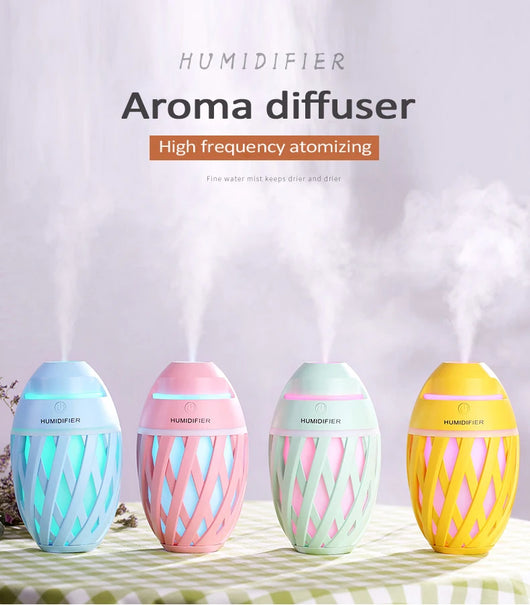 Light green football-shaped humidifier with a decorative lattice pattern and a power button on top. - Image 7