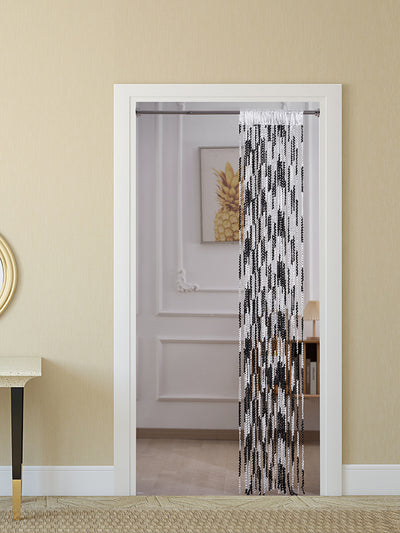 Brown and beige striped string curtain with twisted tassel texture, held by a hand, for living room partition. - Image 2