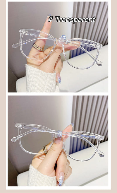 Black full-frame round anti-blue light glasses held by a hand with a gold ring and light blue gradient nails. - Image 21