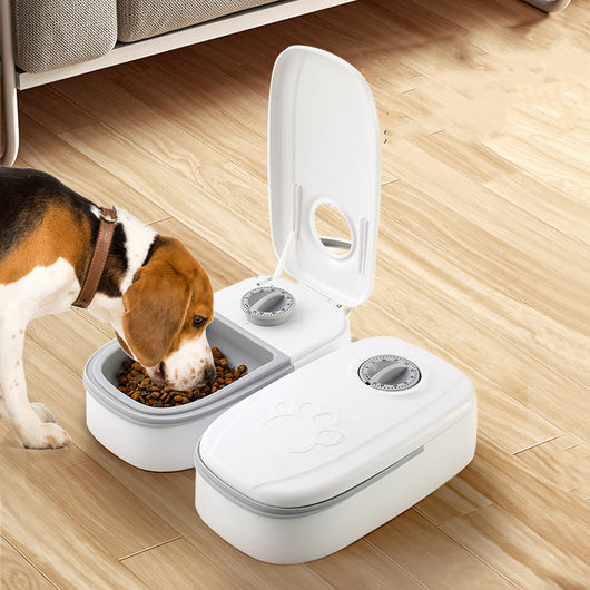 White automatic pet feeder with a pink timer dial and an embossed paw print on the lid. - Image 7